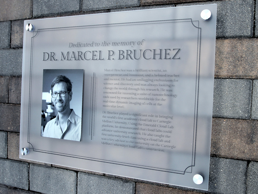 24"w x 18"h x 1/4" thick frosted acrylic panel B&W Halftone printed photo and Black text printed direct to face Includes (4) stainless steel stand offs for installation