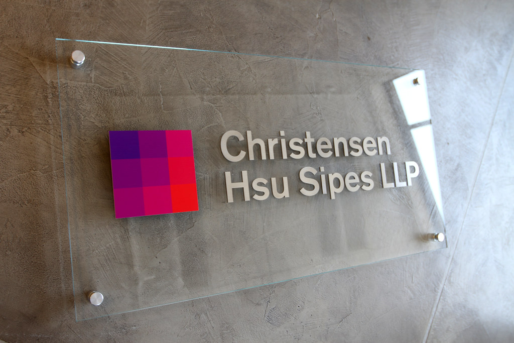 42" x 22" Clear Glass Panel Sign with raised UV printed logo shape and 1/16" thick metal lettering assembled flush to the face of the glass (4) standoffs included for mounting