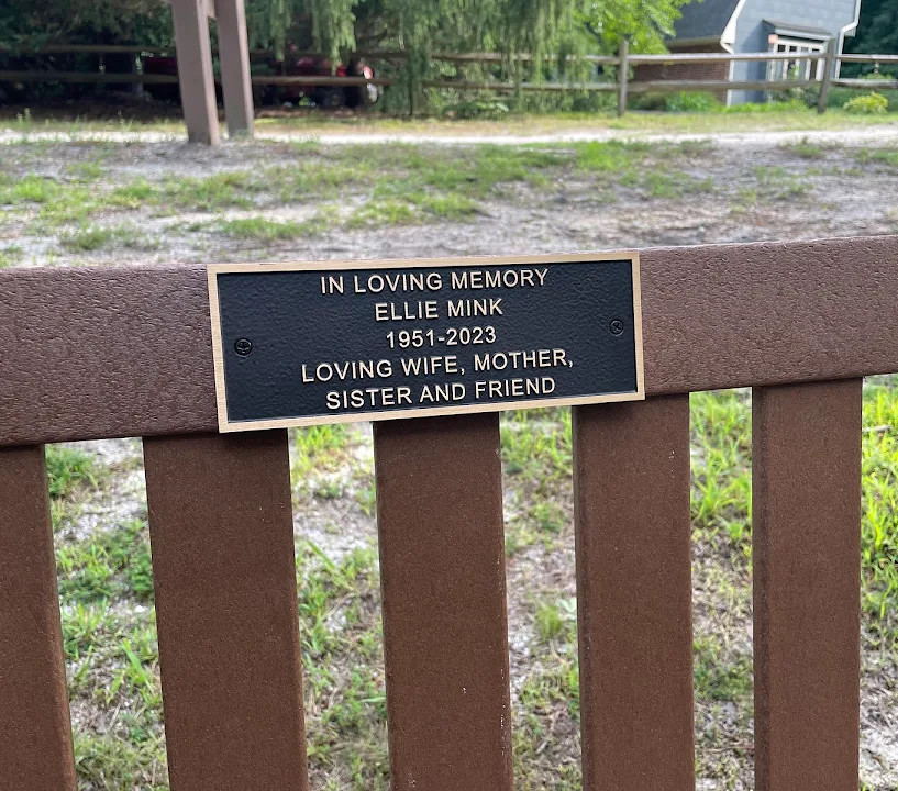 8"w x 2.9"h bronze bench plaque with Satin finish raised lettering and border Recessed paintfilled background in Dark Oxide Leatherette screws through face for customer mounting exterior use