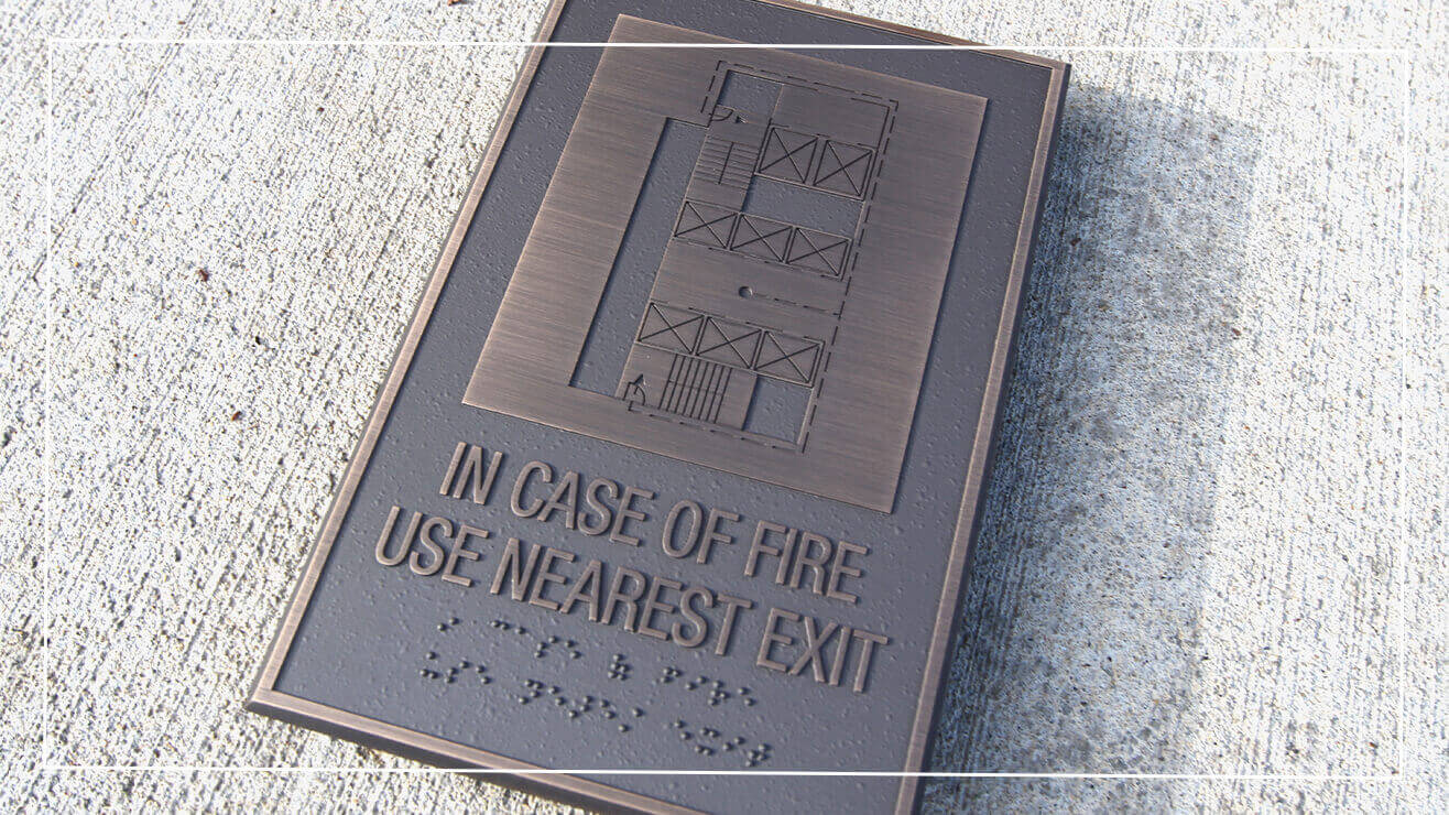 Example of accessibility consideration on a wayfinding sign.