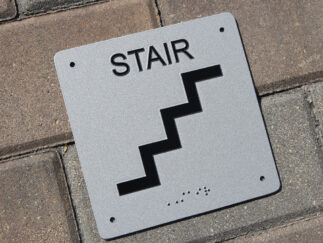 ADA Zinc plaque with raised lettering symbol and braille