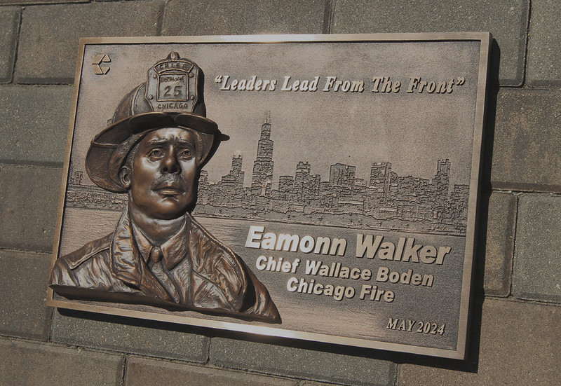 Bas relief bronze sculpture plaque with raised lettering 