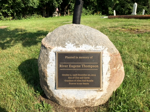 bronze memorial plaque on rock