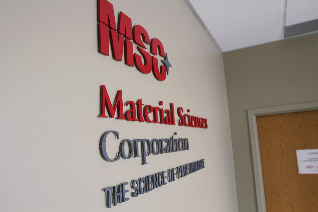 Cut metal logo lettering painted in 2 custom colors