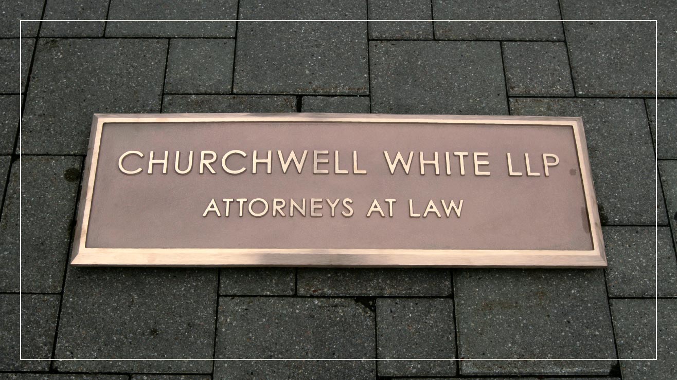 An example cast metal business sign from Impact Signs.