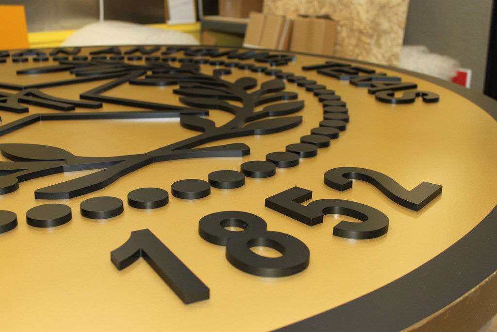 Gold Fabricated Panel with Raised Aluminum Letters on Face