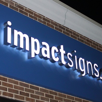 Dimensional letters mounted on a panel sign