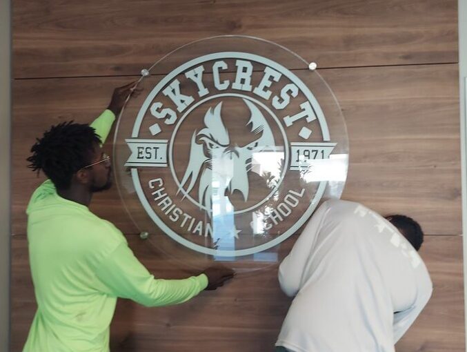 Installation of custom glass circle logo panel sign