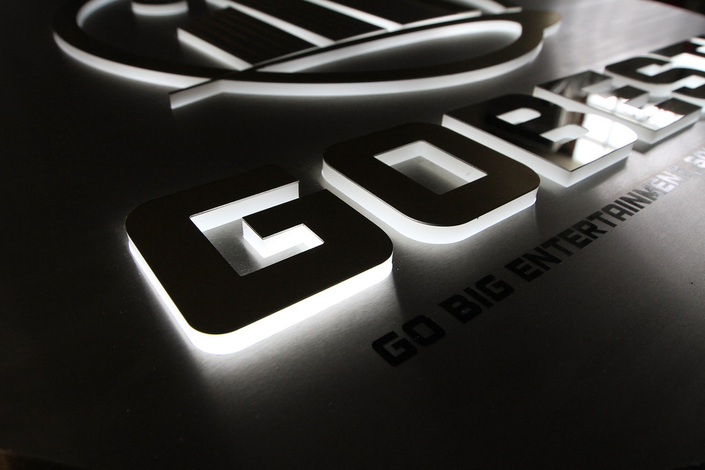 Lighted Lobby Sign Fabricated stainless steel panel with pushthru acrylic letters and graphics for edge lighting detail