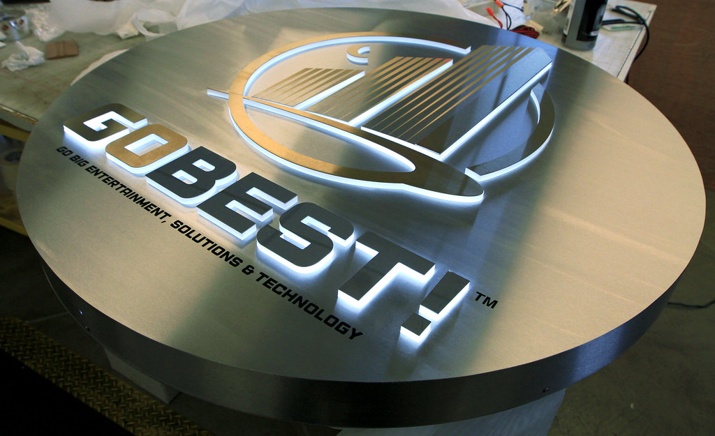 Lighted Lobby Sign Fabricated stainless steel panel with pushthru acrylic letters and graphics for edge lighting detail