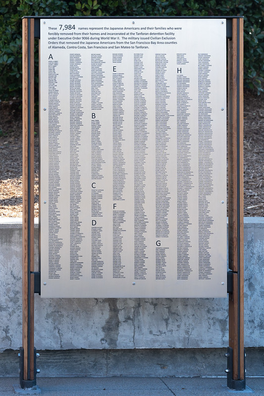 Outdoor stainless steel memorial wall as a part of a public structure