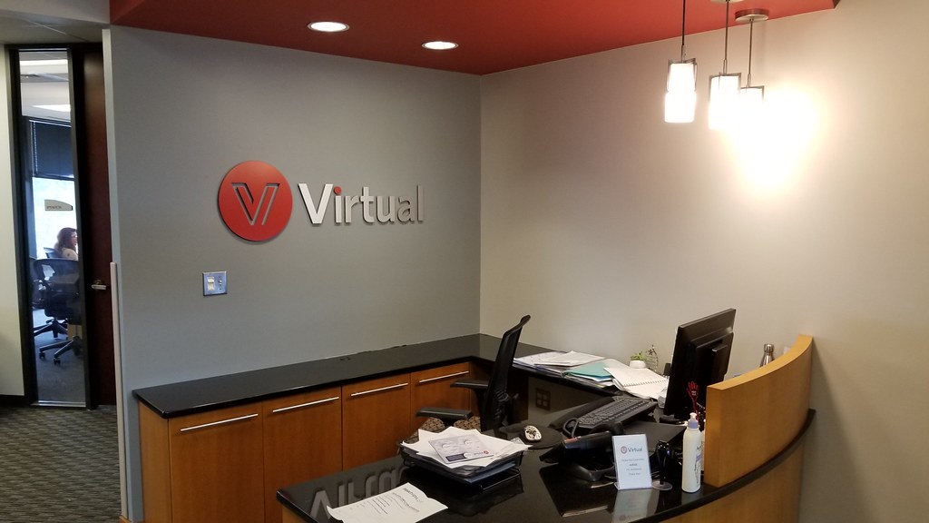 Painted and brushed interior lobby cut aluminum sign