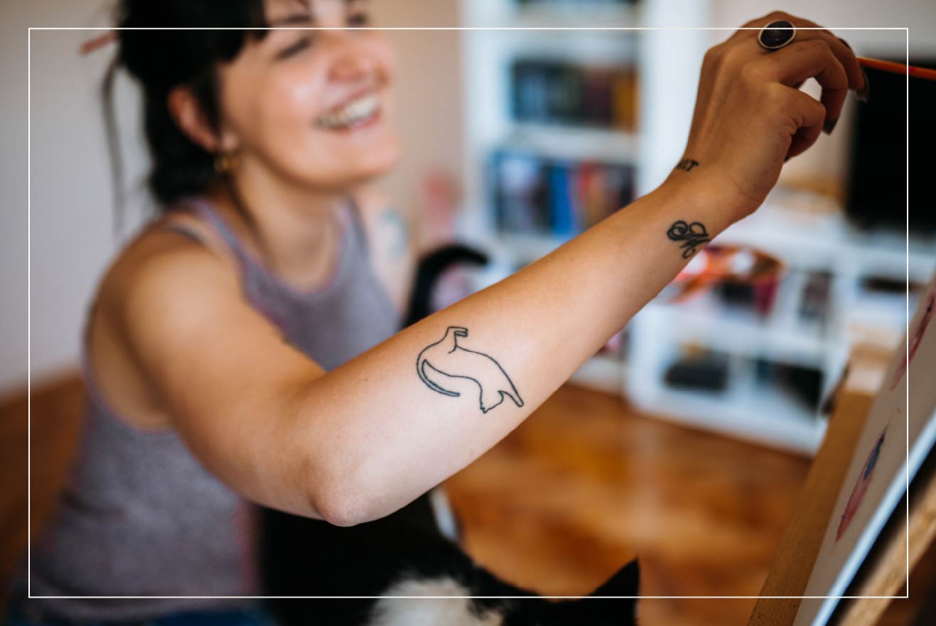 Tattoo of a pet’s silhouette as a form of memorial.